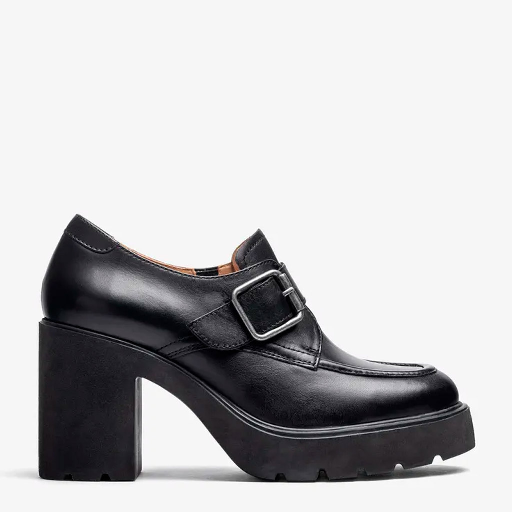 Black leather Killen moccasin by Unisa, featuring a metal buckle and a thick high heel on a tank sole