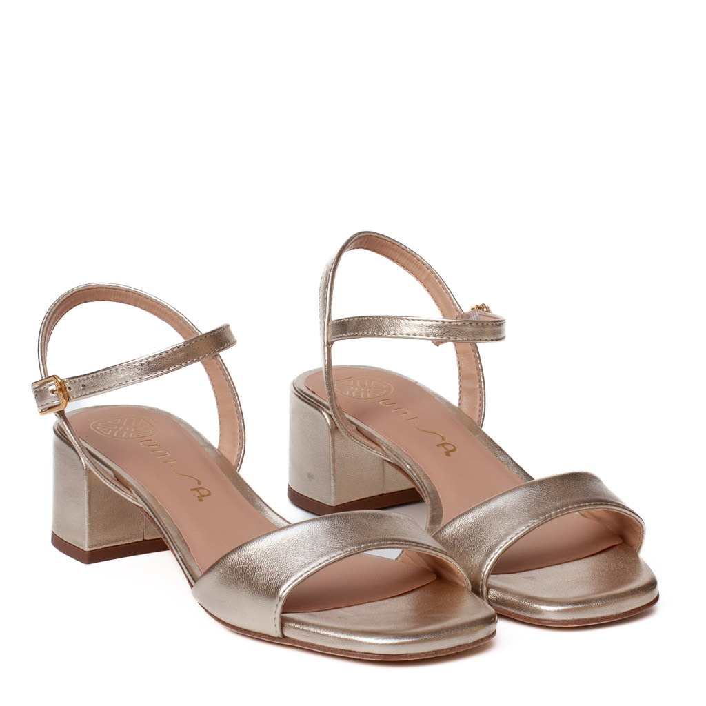 Kirk Unisa low-heeled platinum sandals in metallic nappa leather with an ankle strap.