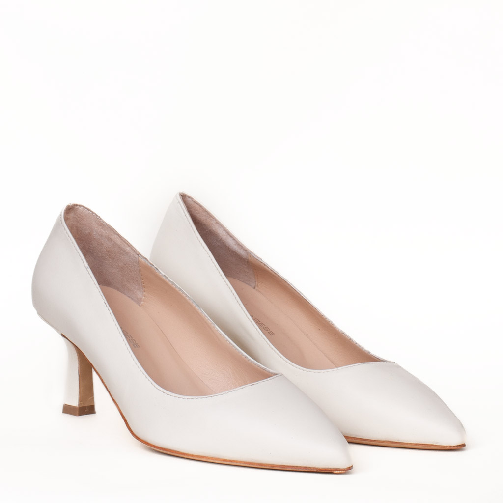 Ivory-coloured pointed-toe leather court shoes with a medium-height spool heel.