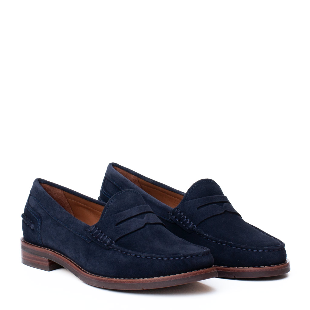 Blue suede low-top trainers with a rubber sole and hand-stitched detailing.