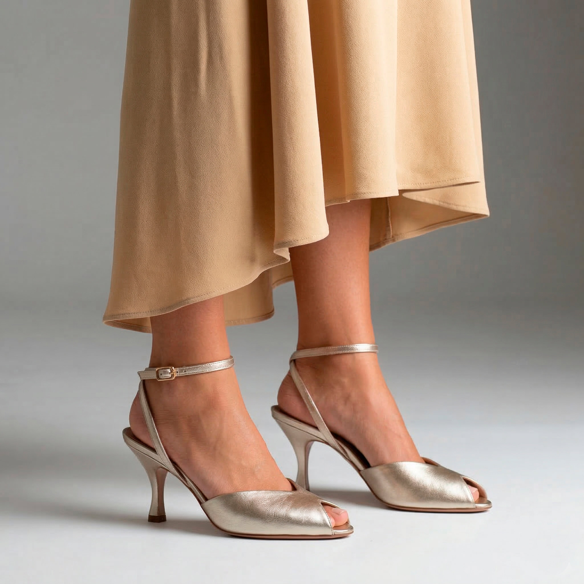Gold sandals with a spool heel in metallic nappa leather