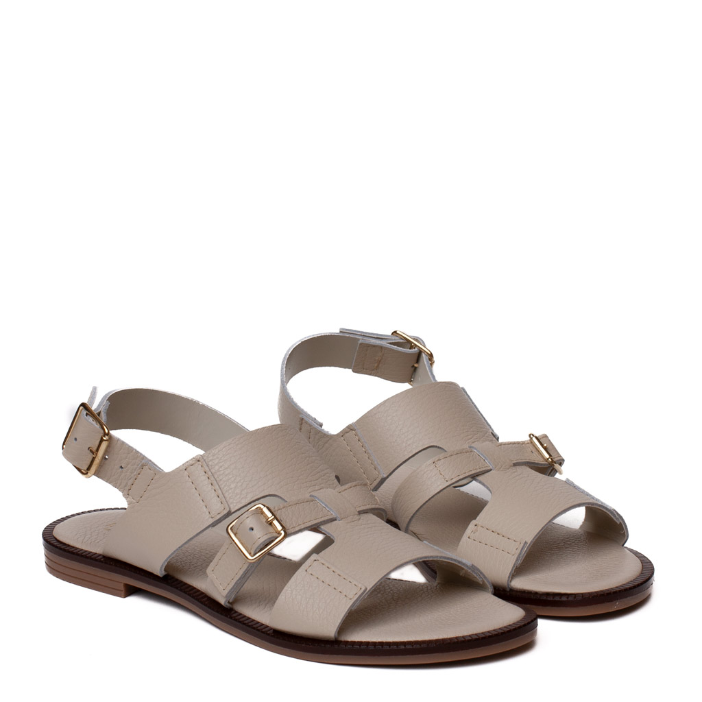 andalo basso nappa beige con doppia fibbia laterale e cinturino regolabile.