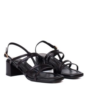 Black Kalma sandals by Unisa, featuring a wide heel and made from black leather with criss-cross straps.