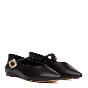 Black leather low-top trainers with a metal buckle and a rubber sole.